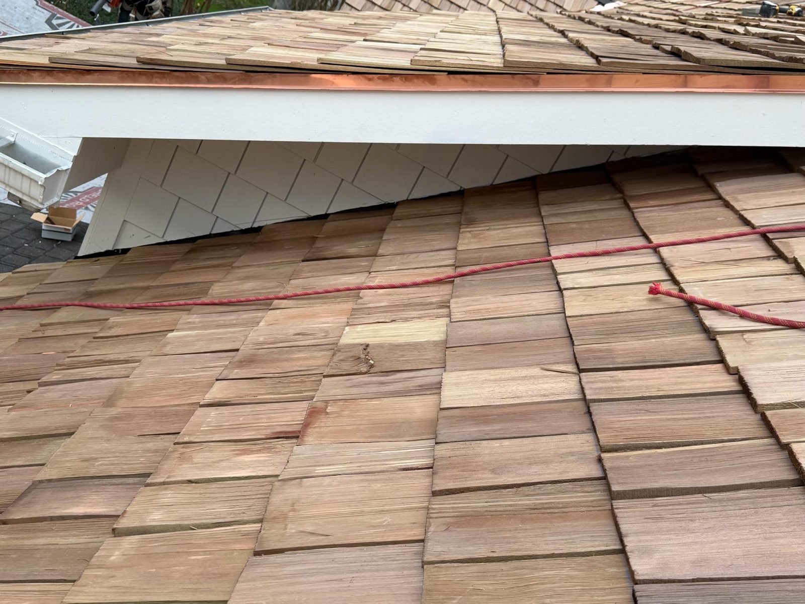 Close view of a finished asphalt shingle roof by HB Contracting