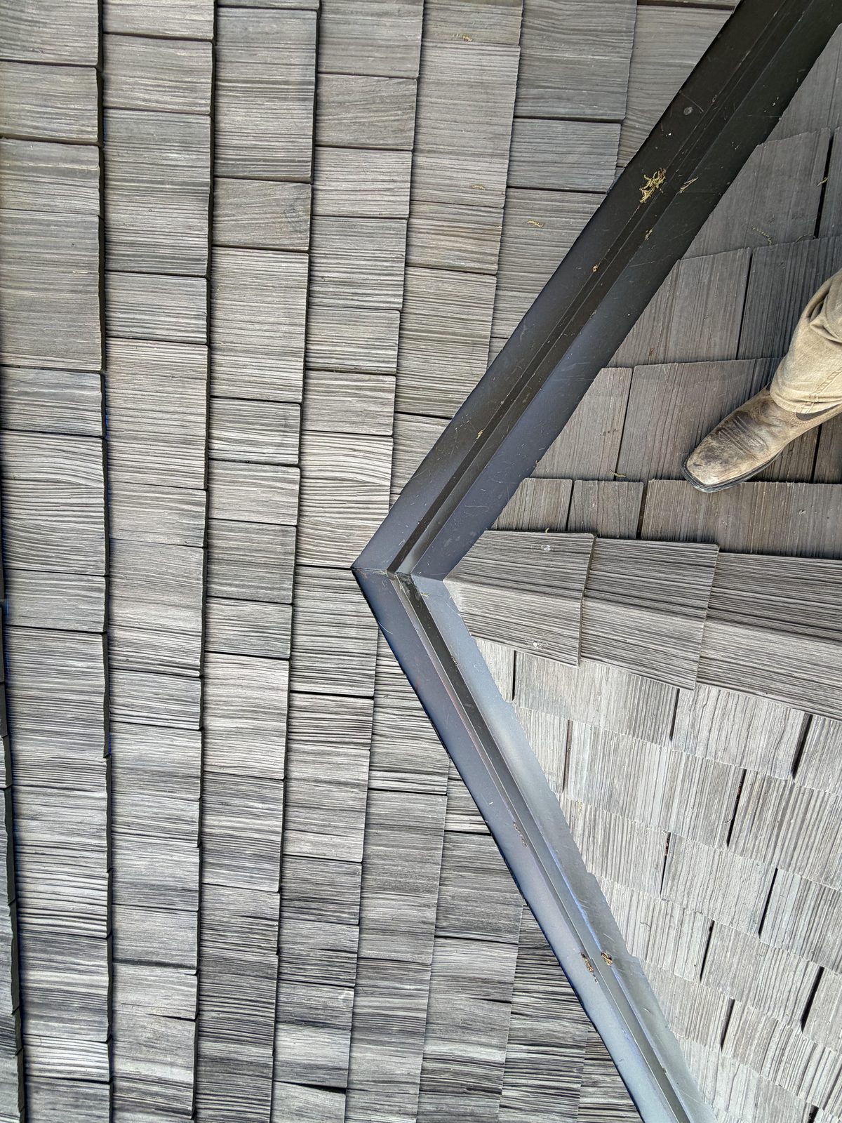 Precision shingle valley detail on a completed roof installation